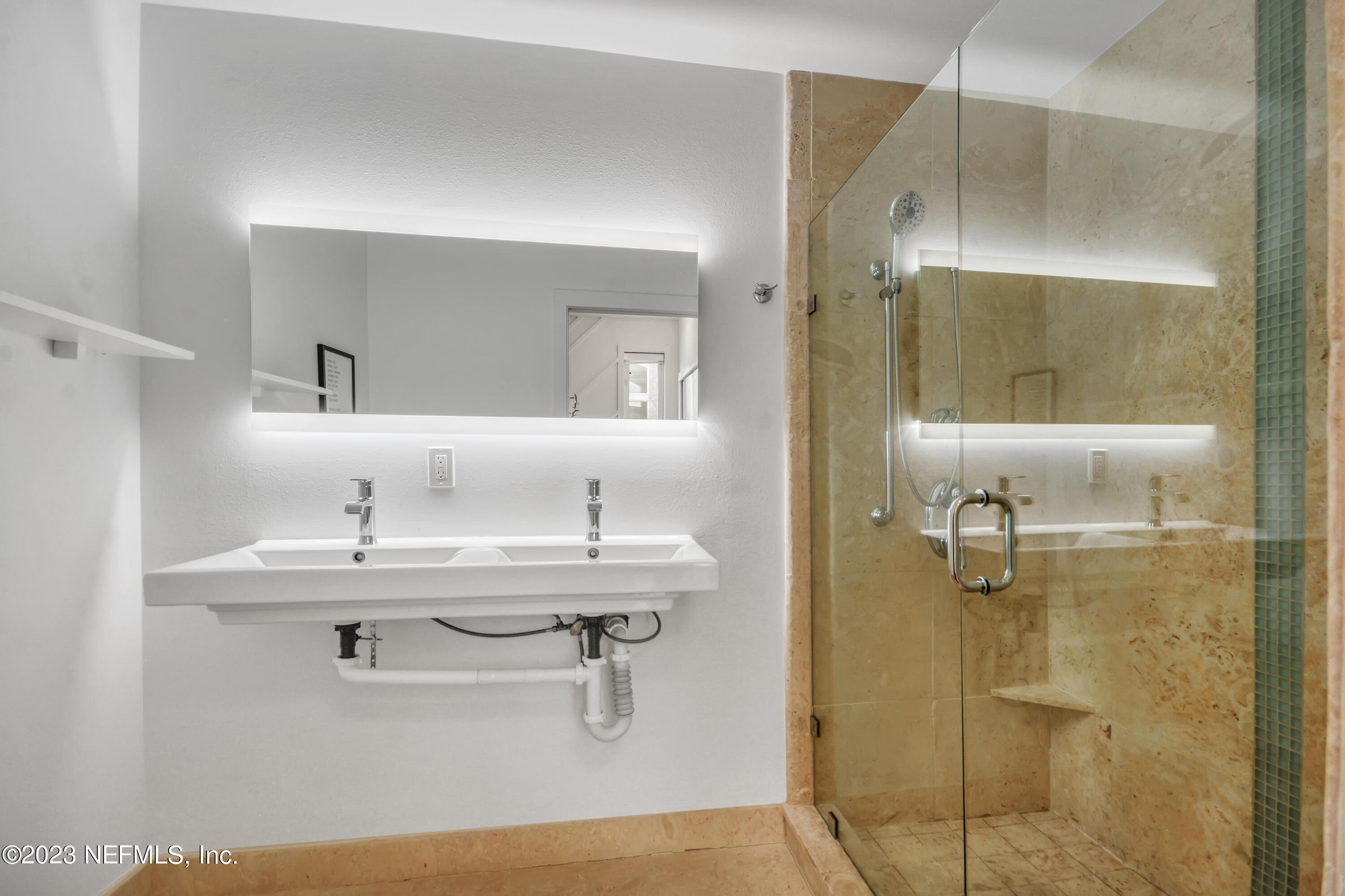 18 North St Augustine Boulevard, Unit 11 St. Augustine, FL 32080 - Photo 22 of 37 a bathroom with a sink and mirror
