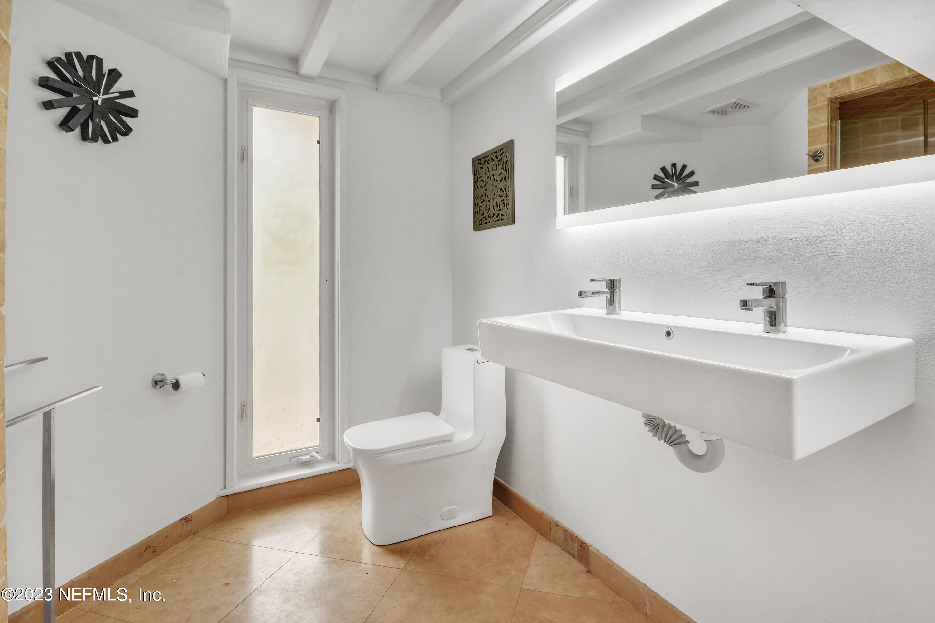 18 North St Augustine Boulevard, Unit 11 St. Augustine, FL 32080 - Photo 26 of 37 a bathroom with a sink and a mirror