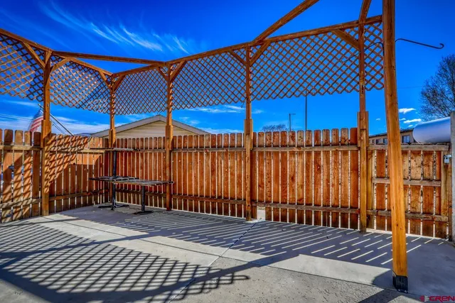 a view of a backyard with sitting area
