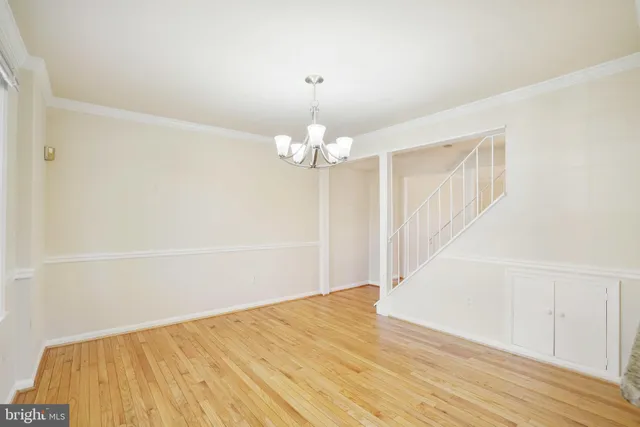 a kitchen with stainless steel appliances granite countertop a sink and a granite counter tops with a large window