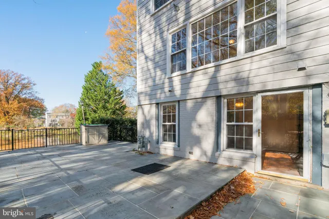 a view of a yard with wooden fence