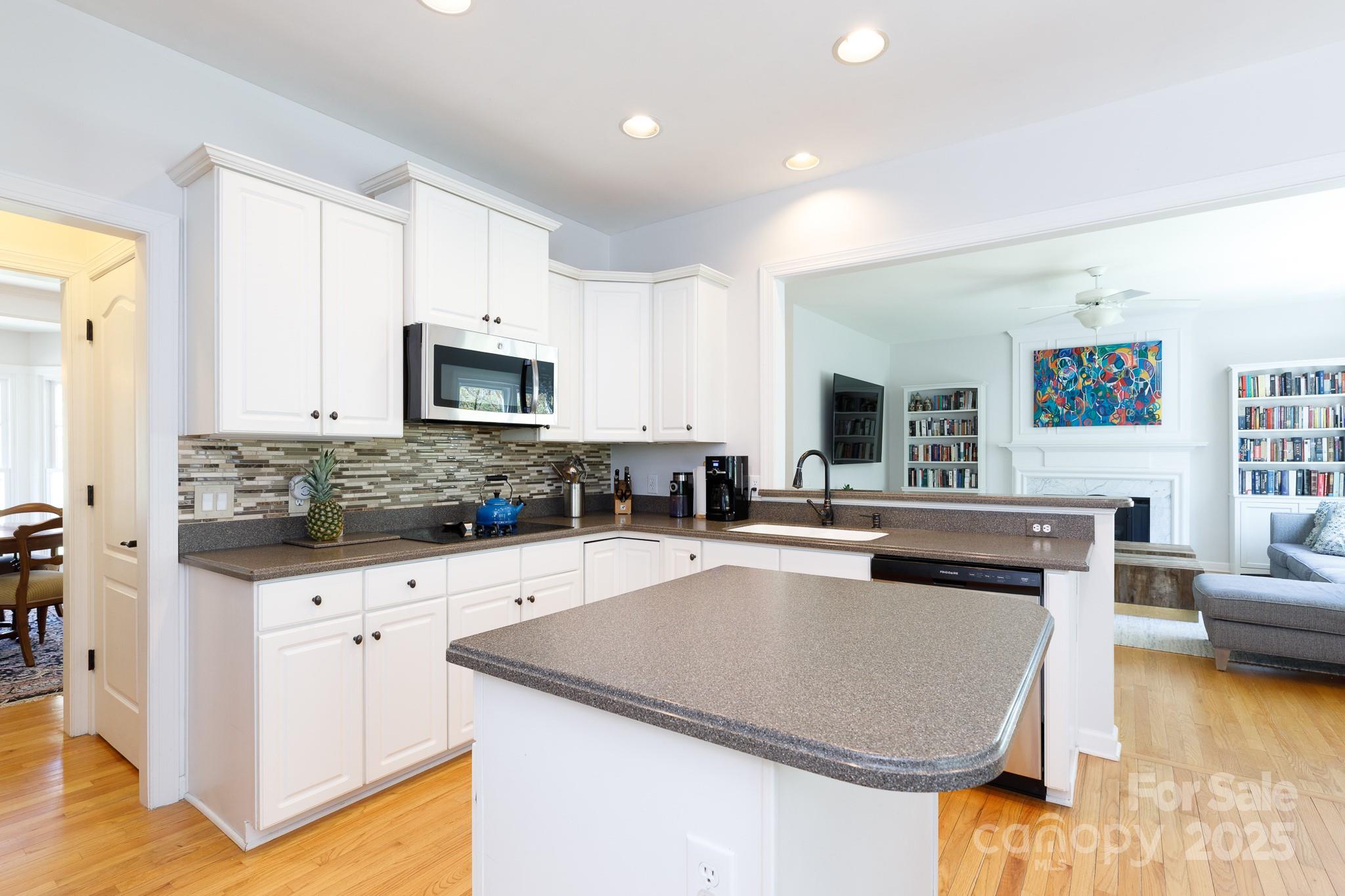 2815 Providence Spring Lane Charlotte, NC 28270 - Photo 12 of 42 a kitchen with granite countertop a stove and a sink