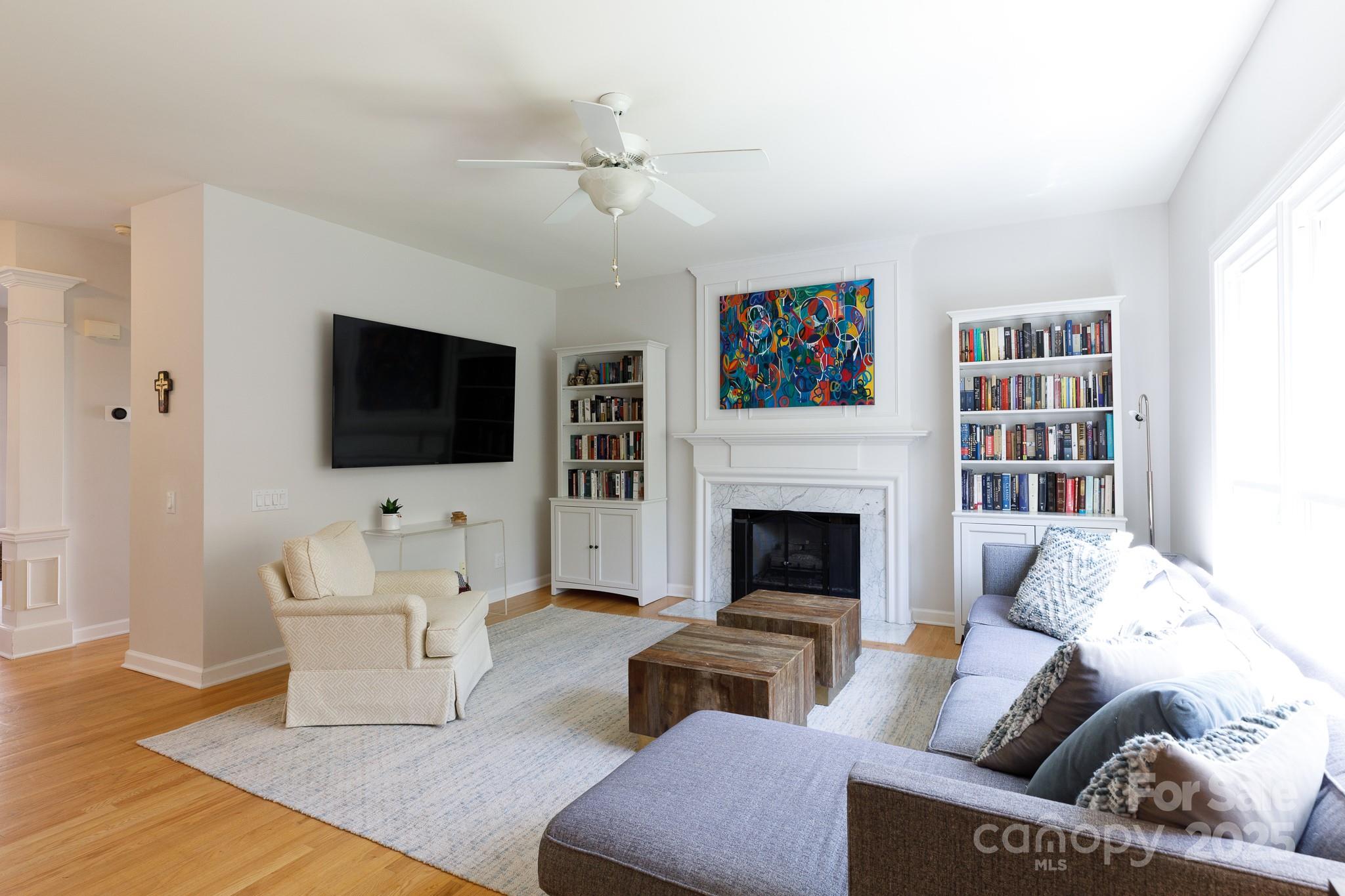2815 Providence Spring Lane Charlotte, NC 28270 - Photo 16 of 42 a living room with furniture and a flat screen tv
