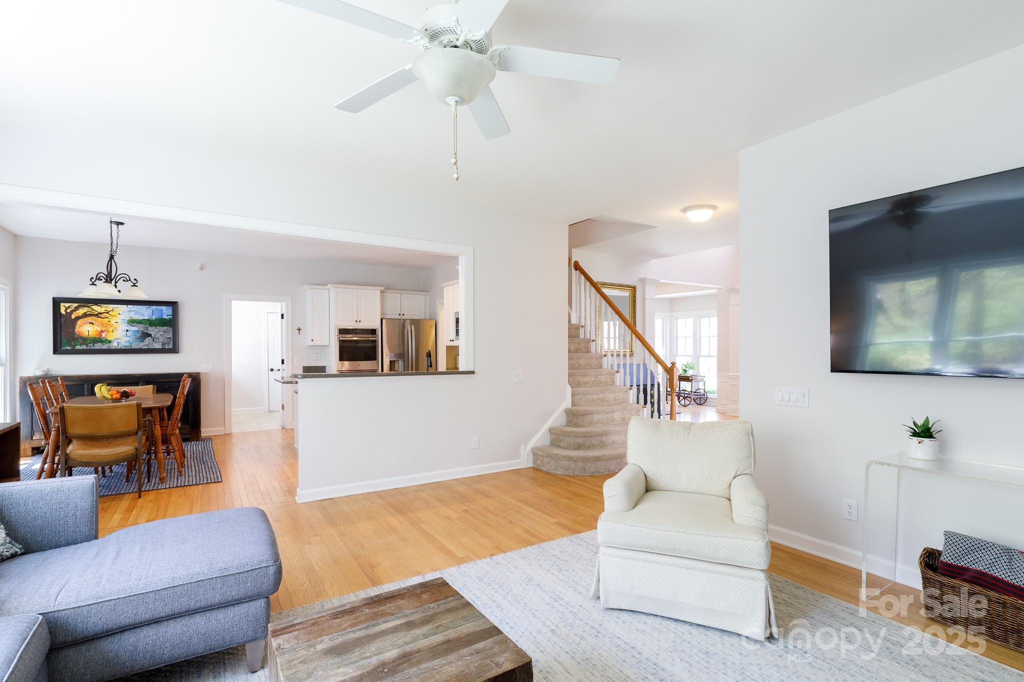 2815 Providence Spring Lane Charlotte, NC 28270 - Photo 17 of 42 a living room with furniture and a flat screen tv