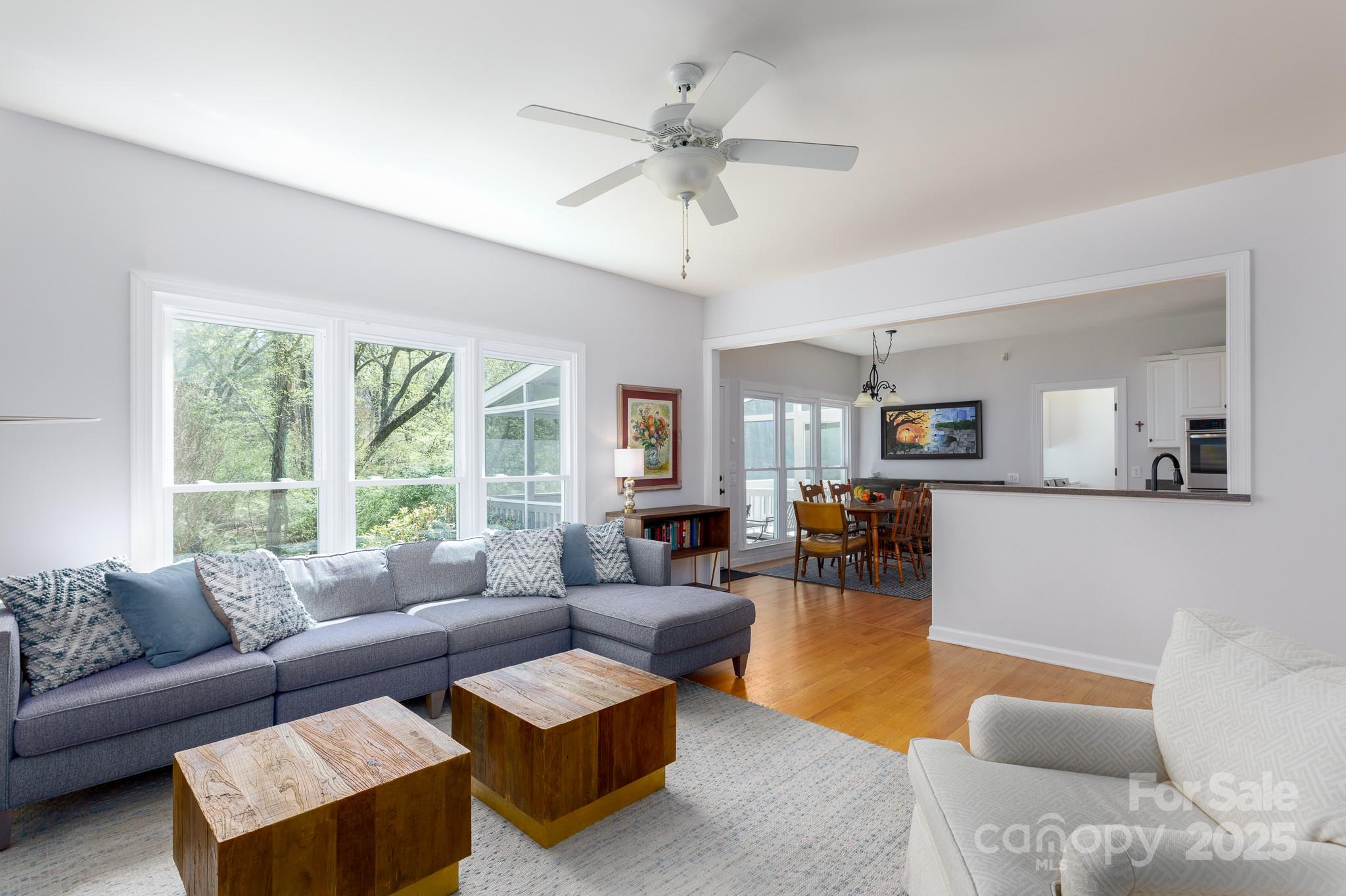 2815 Providence Spring Lane Charlotte, NC 28270 - Photo 18 of 42 a living room with furniture and a large window