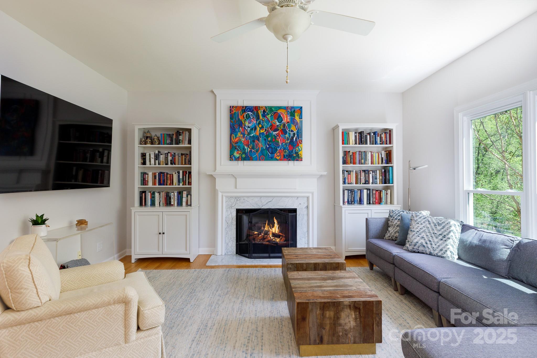 2815 Providence Spring Lane Charlotte, NC 28270 - Photo 19 of 42 a living room with furniture fireplace and flat screen tv