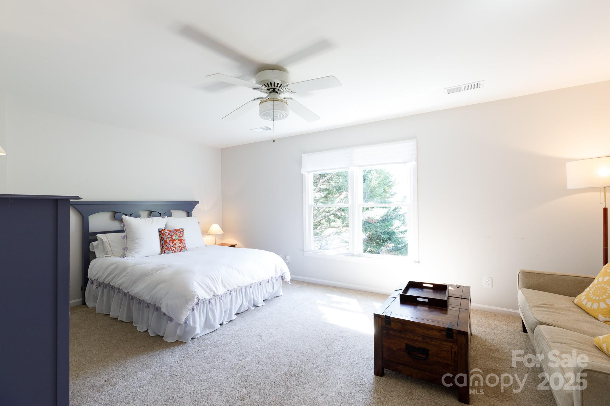 2815 Providence Spring Lane Charlotte, NC 28270 - Photo 20 of 42 a bedroom with a bed furniture and a window