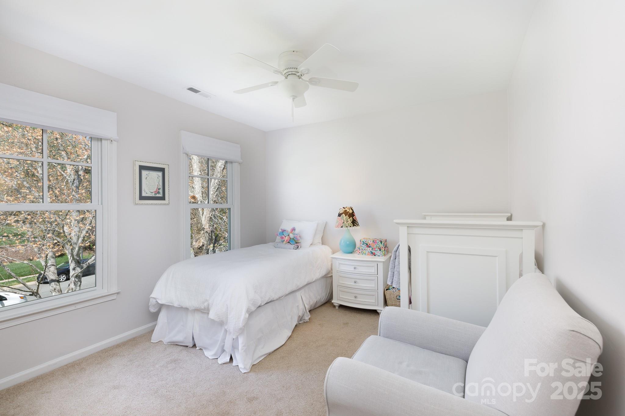 2815 Providence Spring Lane Charlotte, NC 28270 - Photo 25 of 42 a bed room with a bed and a couch