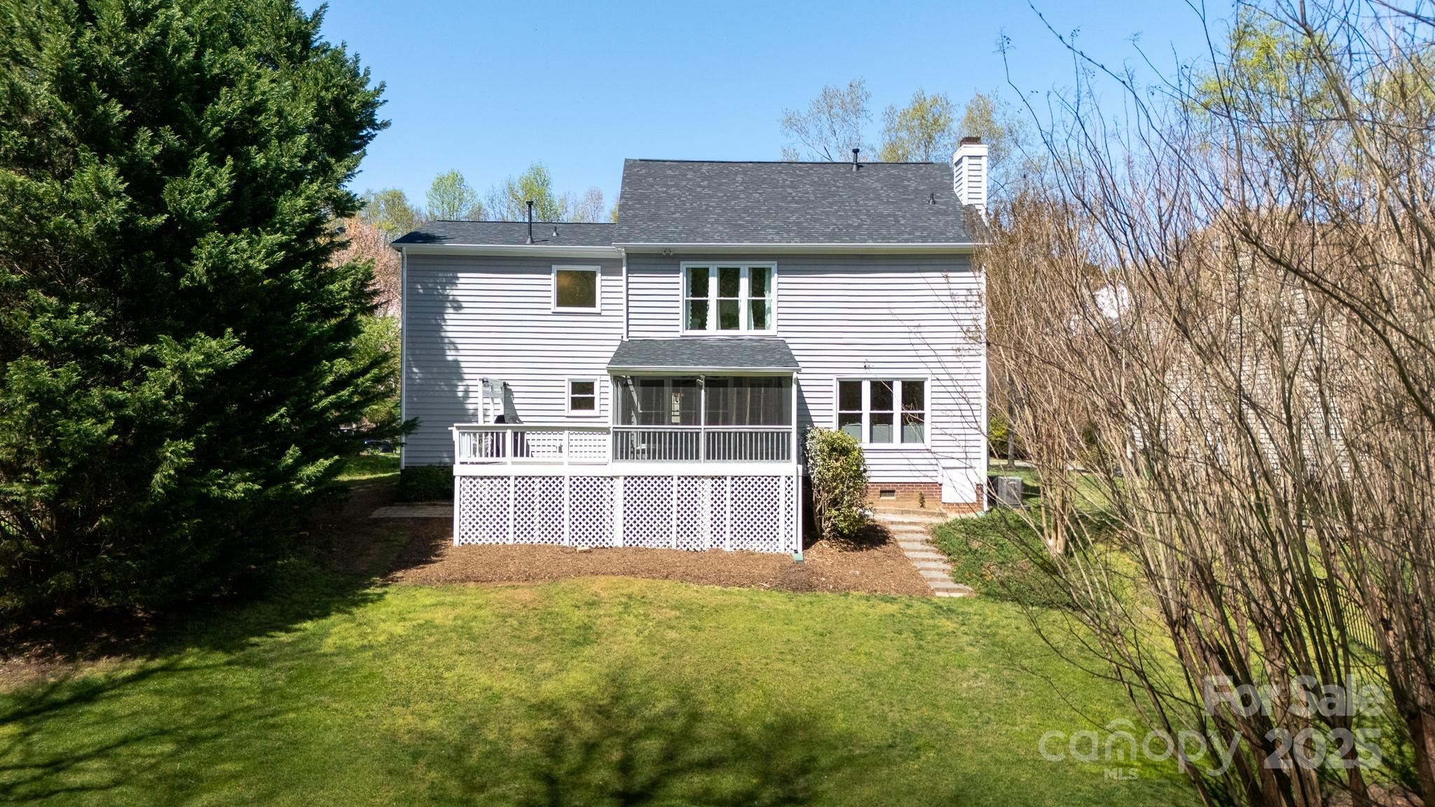 2815 Providence Spring Lane Charlotte, NC 28270 - Photo 32 of 42 a front view of a house with a garden
