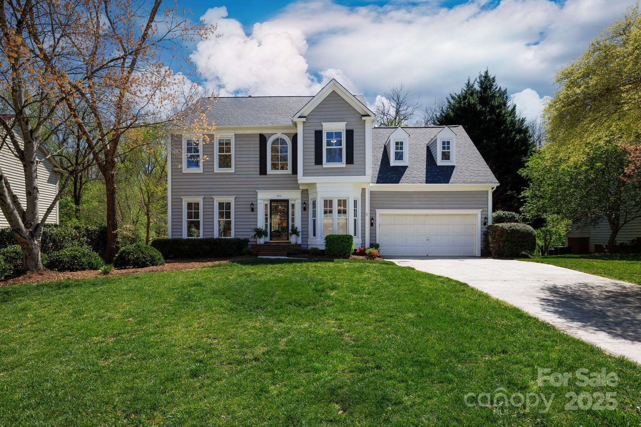 2815 Providence Spring Lane Charlotte, NC 28270 - Photo 4 of 42 a front view of house with yard and green space