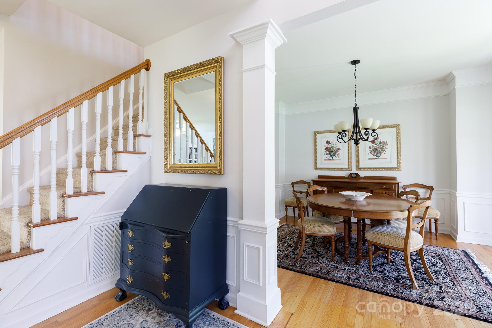 2815 Providence Spring Lane Charlotte, NC 28270 - Photo 6 of 42 a living room with chairs and a table