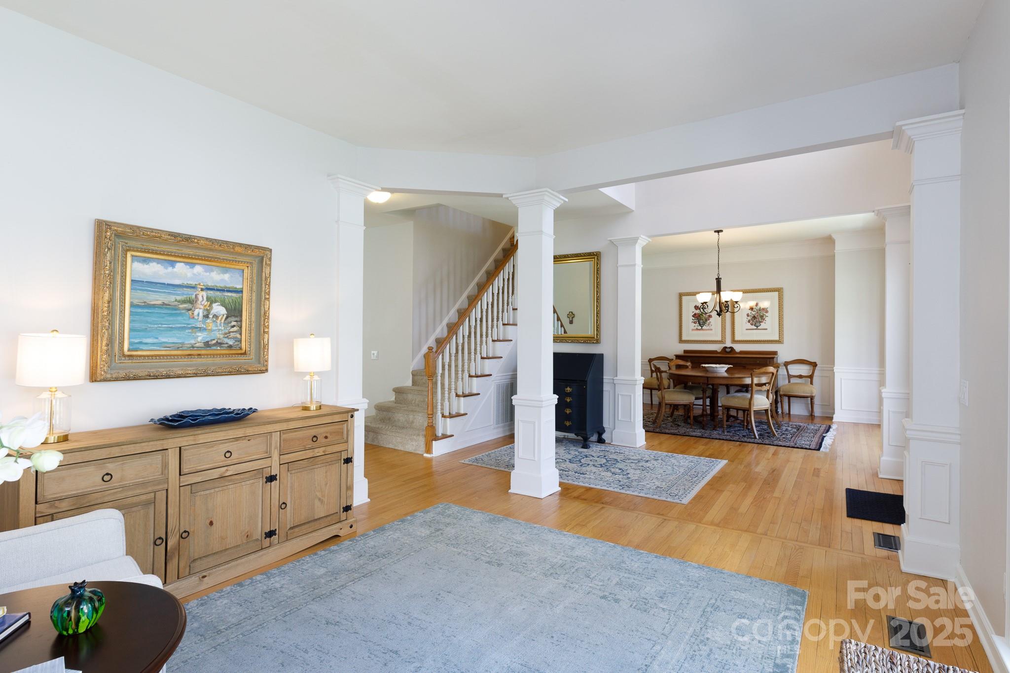 2815 Providence Spring Lane Charlotte, NC 28270 - Photo 10 of 42 a living room with furniture and wooden floor