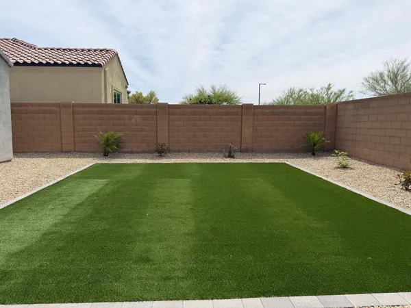 a backyard of a house with lots of green space