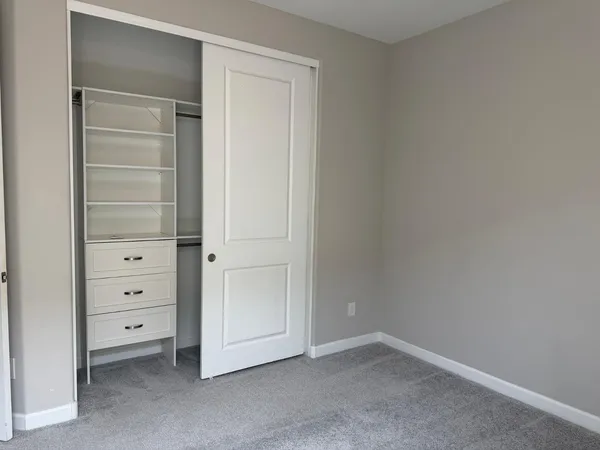 a view of an empty walk in closet
