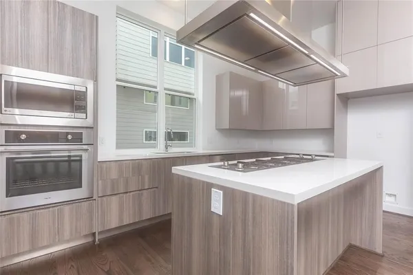 a kitchen with a stove and a microwave