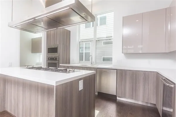 a kitchen with a sink and a refrigerator