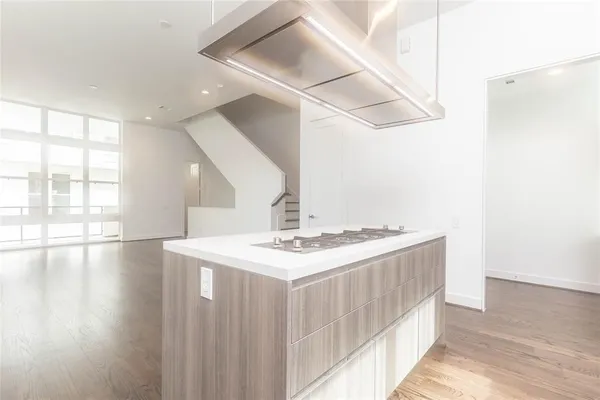 a kitchen with a stove and a table