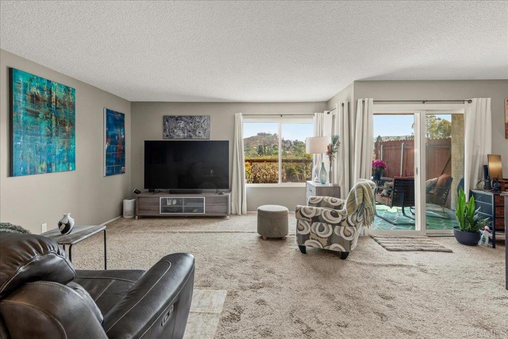 3047 Highlands Boulevard Spring Valley, CA 91977 - Photo 5 of 39 a living room with furniture and a flat screen tv
