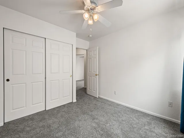 a spacious bathroom with a tub sink and mirror