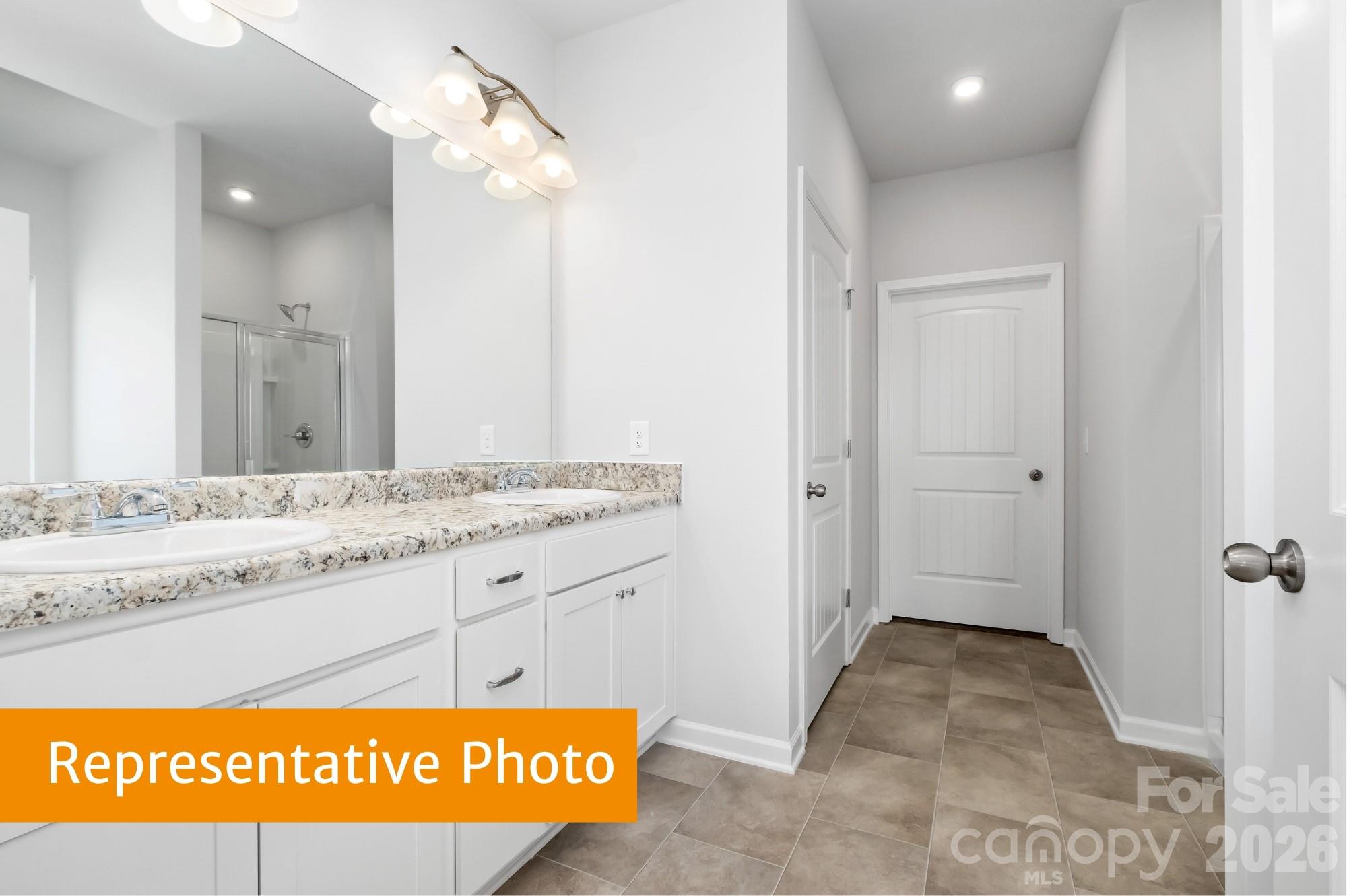 6352 Busch Way Midland, NC 28107 - Photo 14 of 27 a bathroom with a sink and a mirror