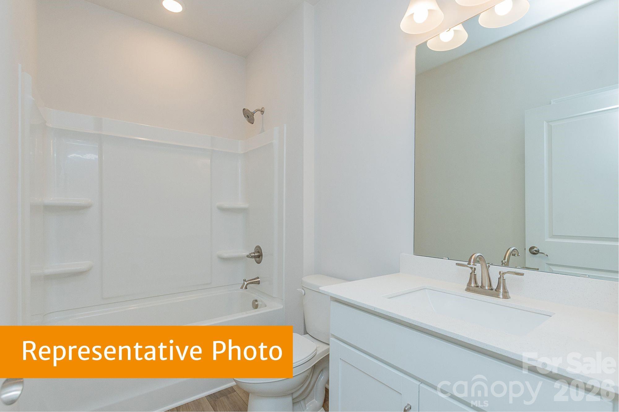 6352 Busch Way Midland, NC 28107 - Photo 20 of 27 a bathroom with a sink a vanity and a mirror
