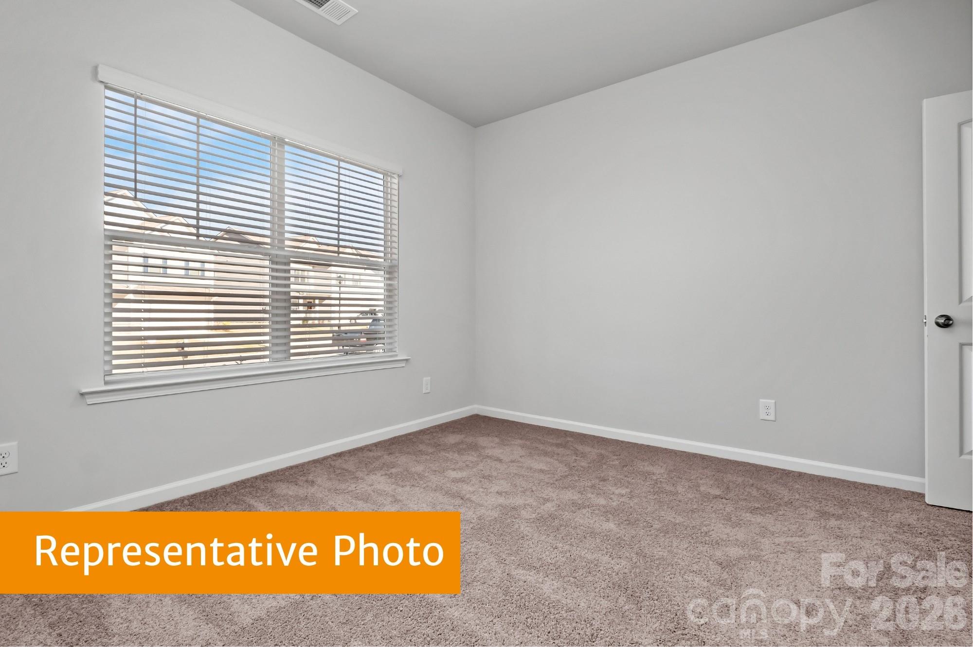 6352 Busch Way Midland, NC 28107 - Photo 21 of 27 a view of an empty room with a window