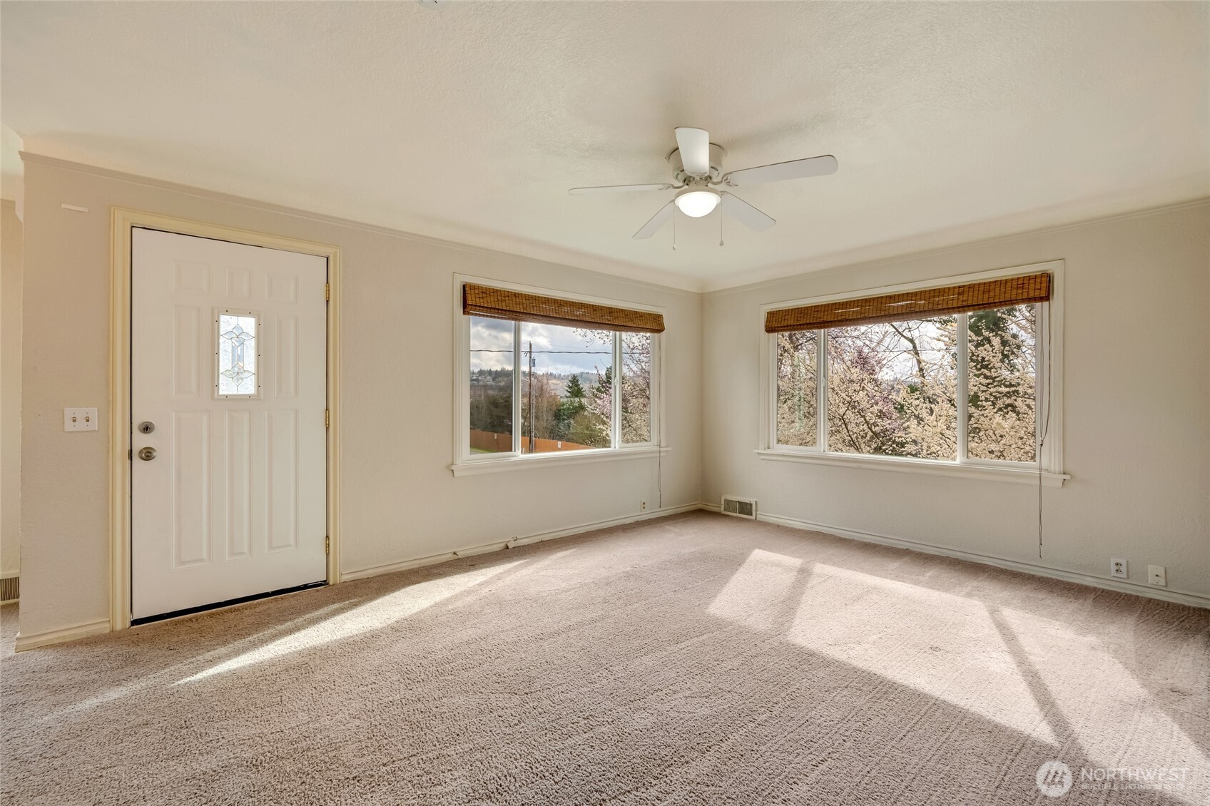 412 Southwest 4th Place Renton, WA 98057 - Photo 5 of 21 an empty room with windows and chandelier fan