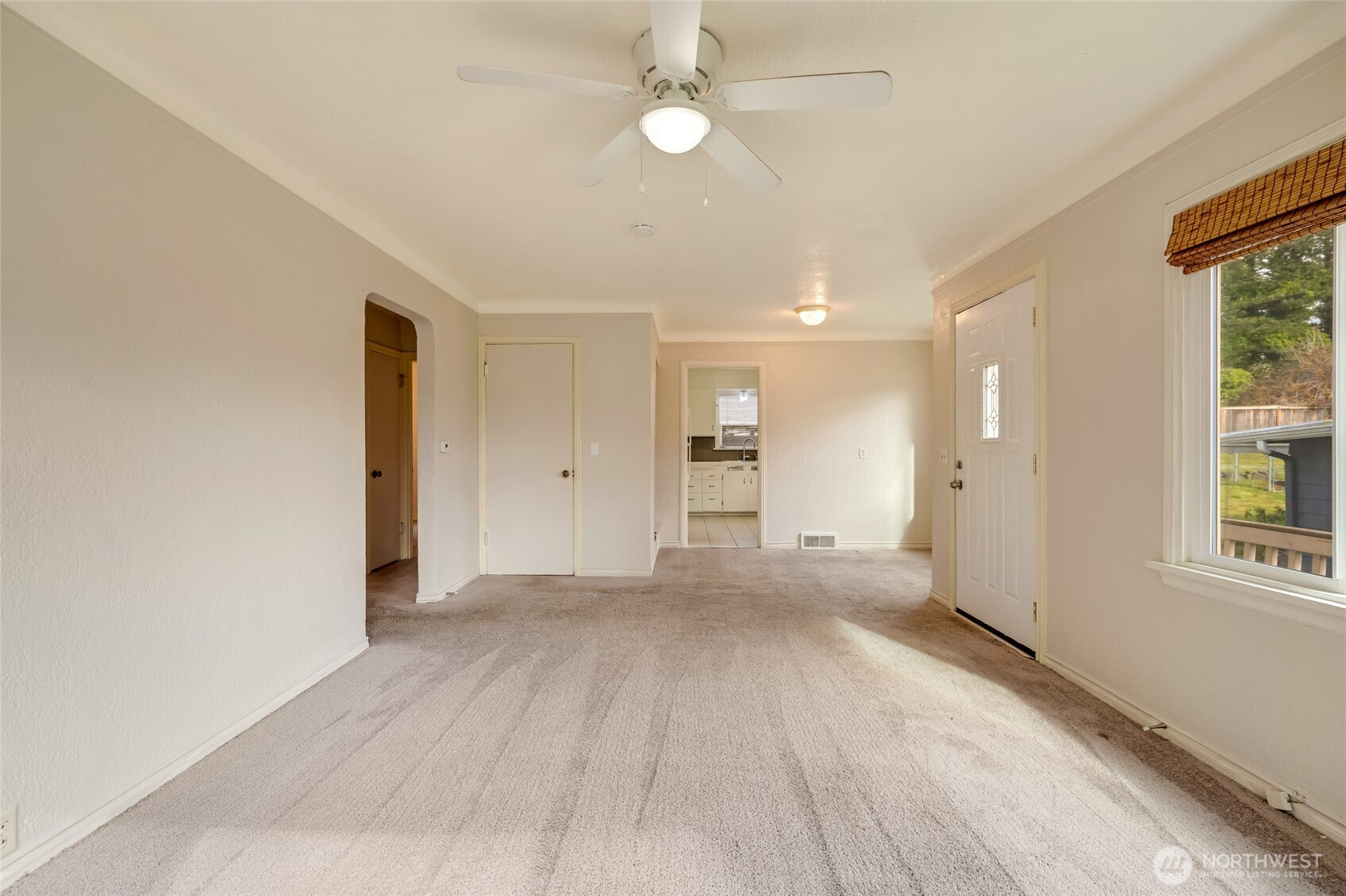 412 Southwest 4th Place Renton, WA 98057 - Photo 6 of 21 an empty room with wooden floor and windows