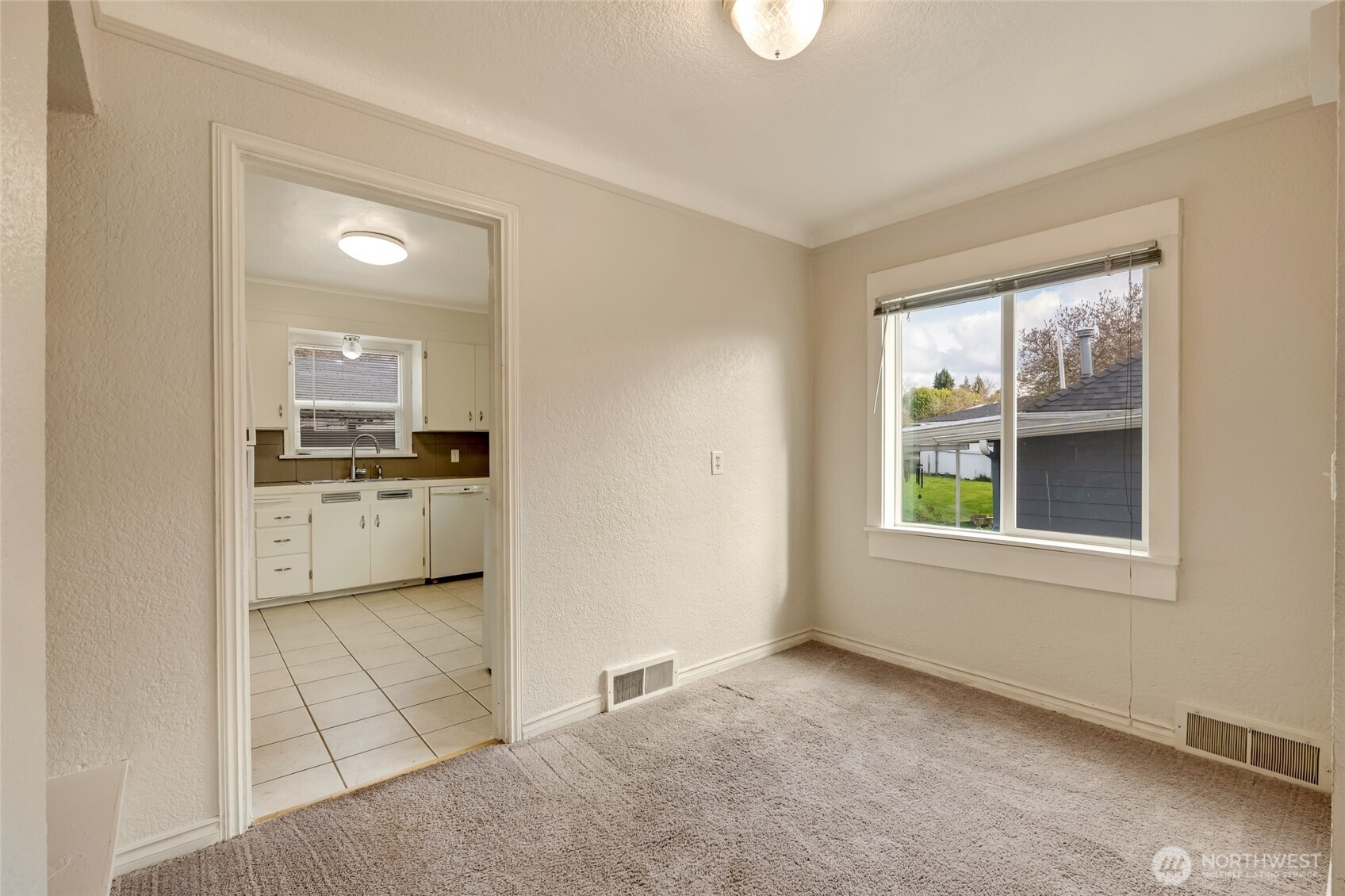 412 Southwest 4th Place Renton, WA 98057 - Photo 7 of 21 an empty room with windows and cabinet