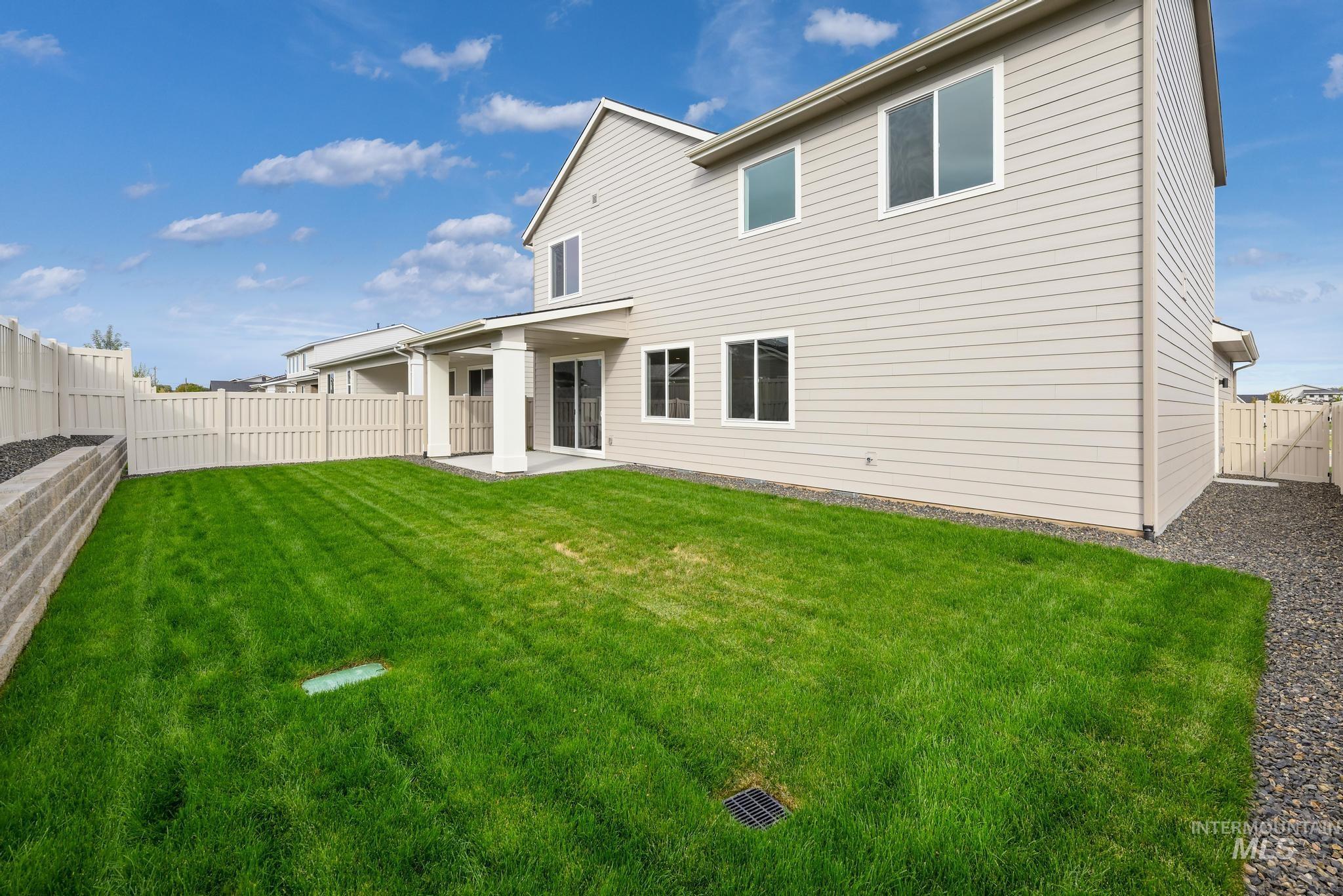 2087 West Gelding Street Middleton, ID 83644 - Photo 30 of 41 Rear view of property with a patio and a fenced backyard
