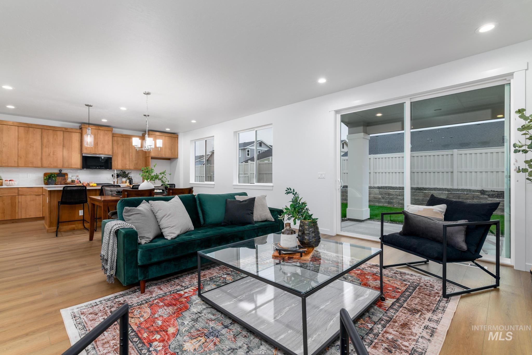 2087 West Gelding Street Middleton, ID 83644 - Photo 10 of 41 Living room with light wood finished floors, recessed lighting, and a chandelier