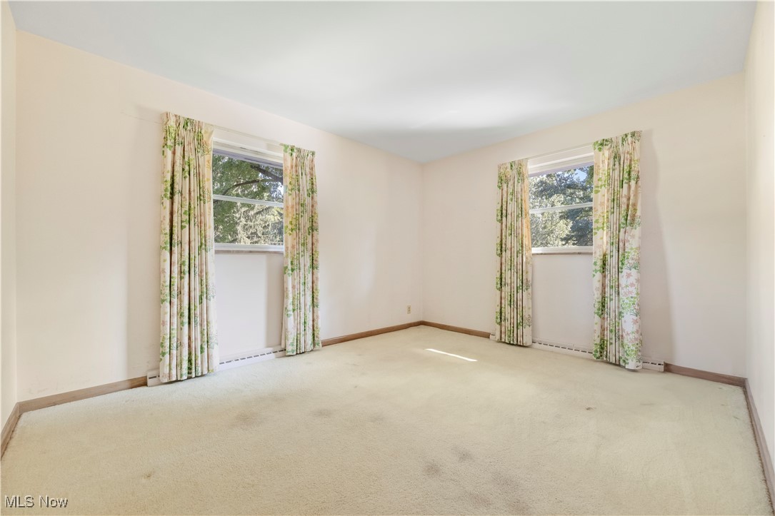 2490 Brice Road Akron, OH 44313 - Photo 27 of 42 Carpeted empty room featuring a wealth of natural light