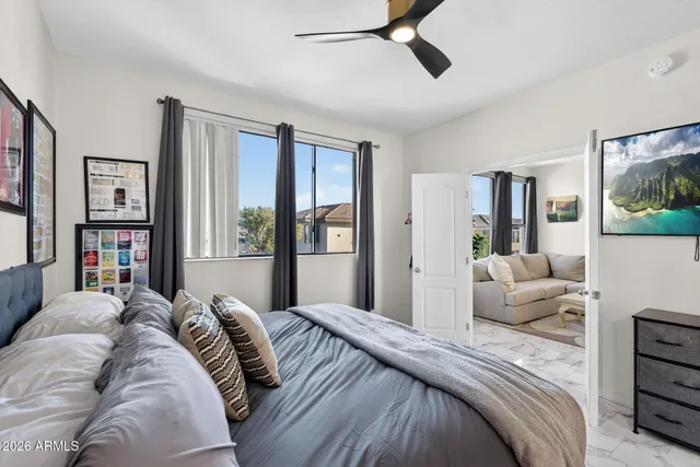 a bedroom with a large bed and a window
