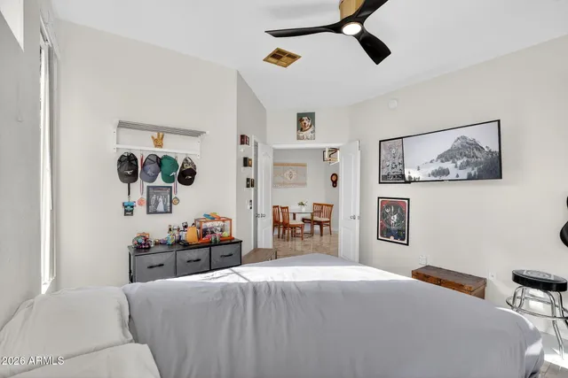 a bedroom with a bed and dresser