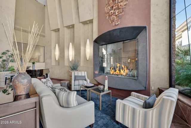 a living room with furniture and a large window