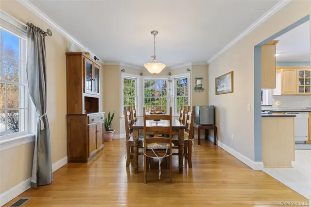a living room with fireplace furniture and a wooden floor