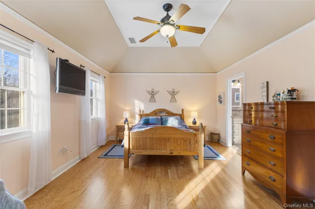 a bedroom with a bed and a chair