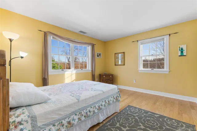 a bedroom with a bed and a table in it