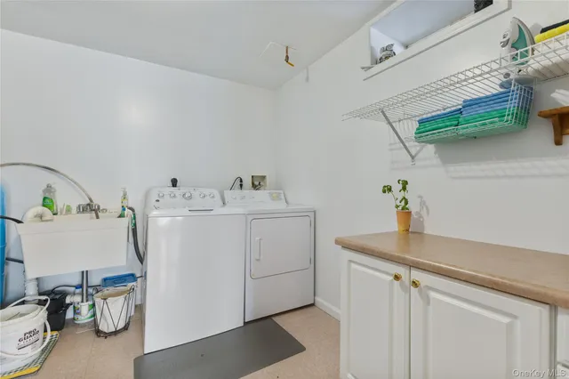 a view of a deck with a floor to ceiling window and wooden fence