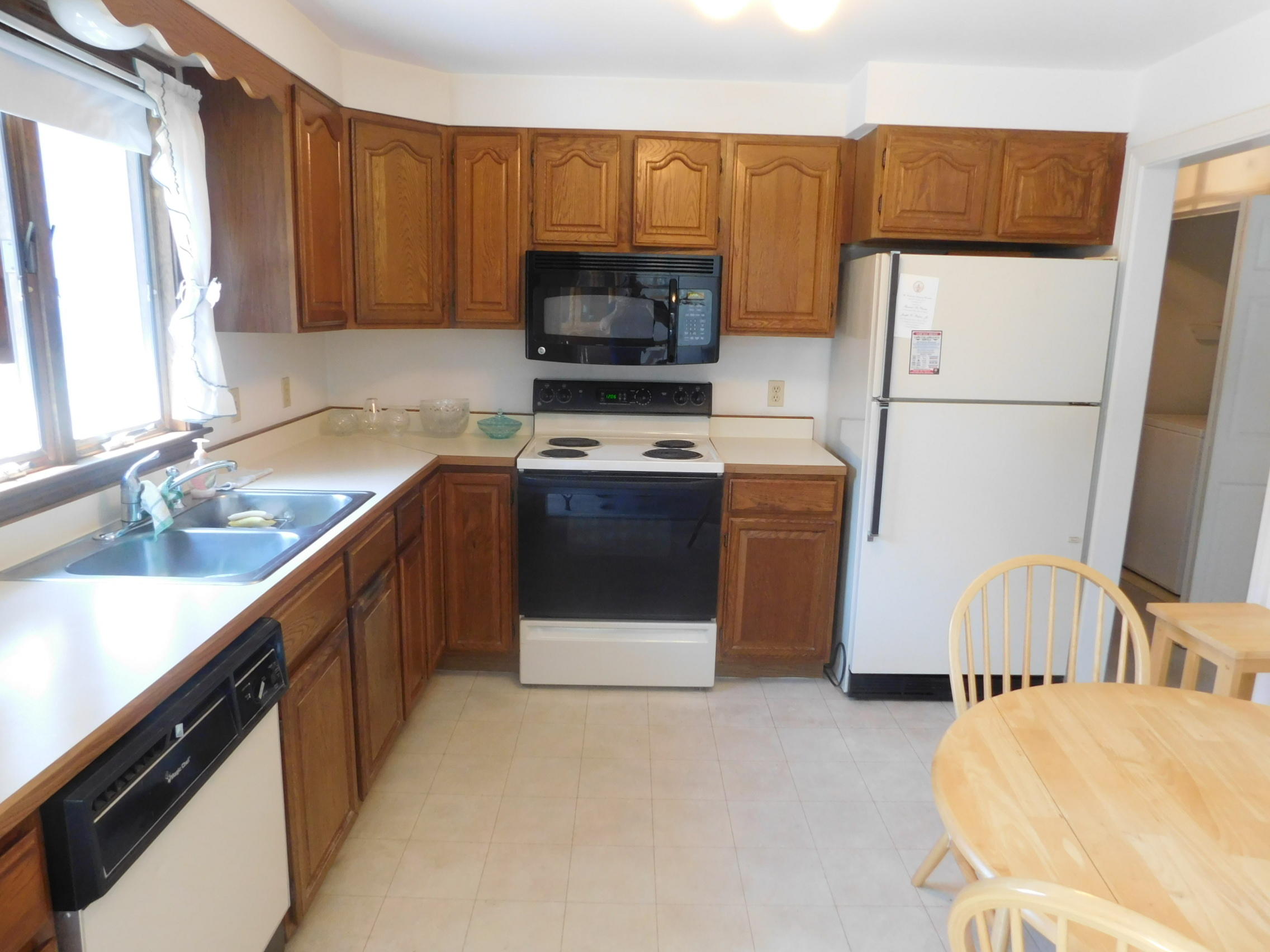 55 Pinecrest Road Centerville, MA 02632 - Photo 3 of 17 a kitchen with stainless steel appliances a stove a sink and a refrigerator