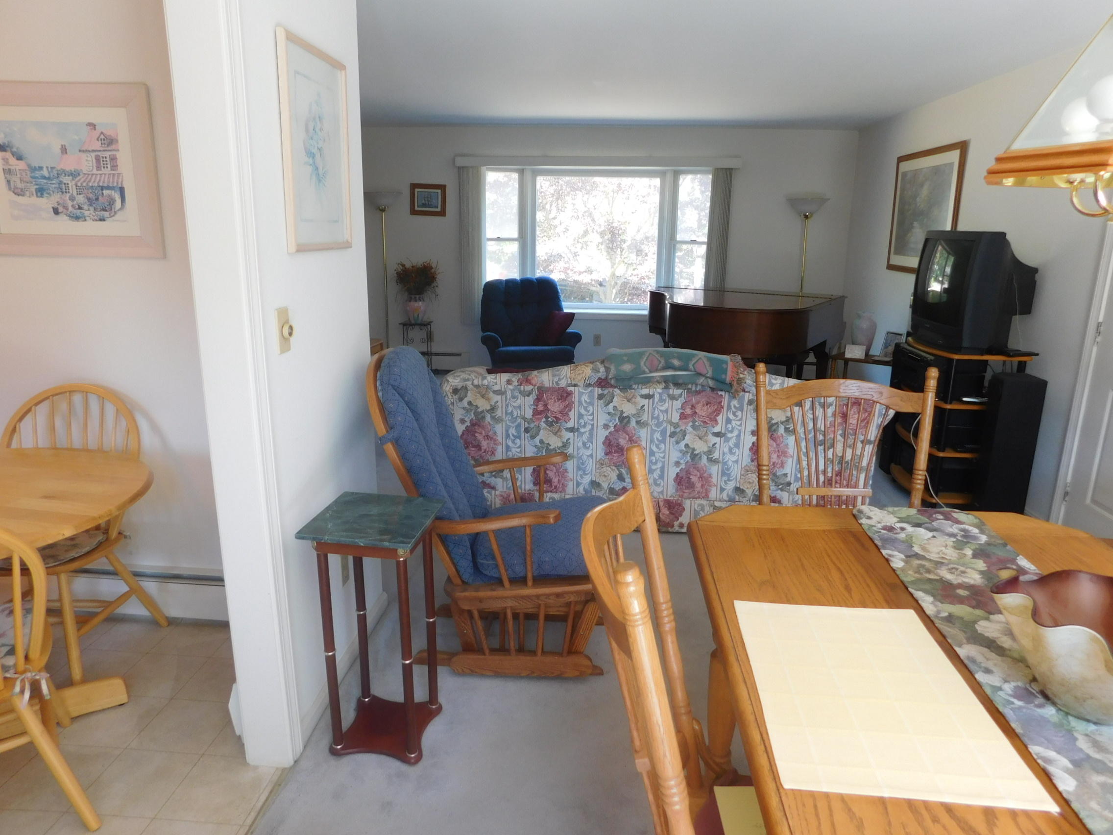 55 Pinecrest Road Centerville, MA 02632 - Photo 8 of 17 a living room with furniture fireplace and a window