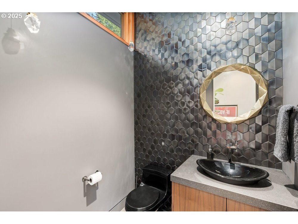 4311 Southwest 36th Place Portland, OR 97221 - Photo 44 of 48 a bathroom with a sink and a mirror