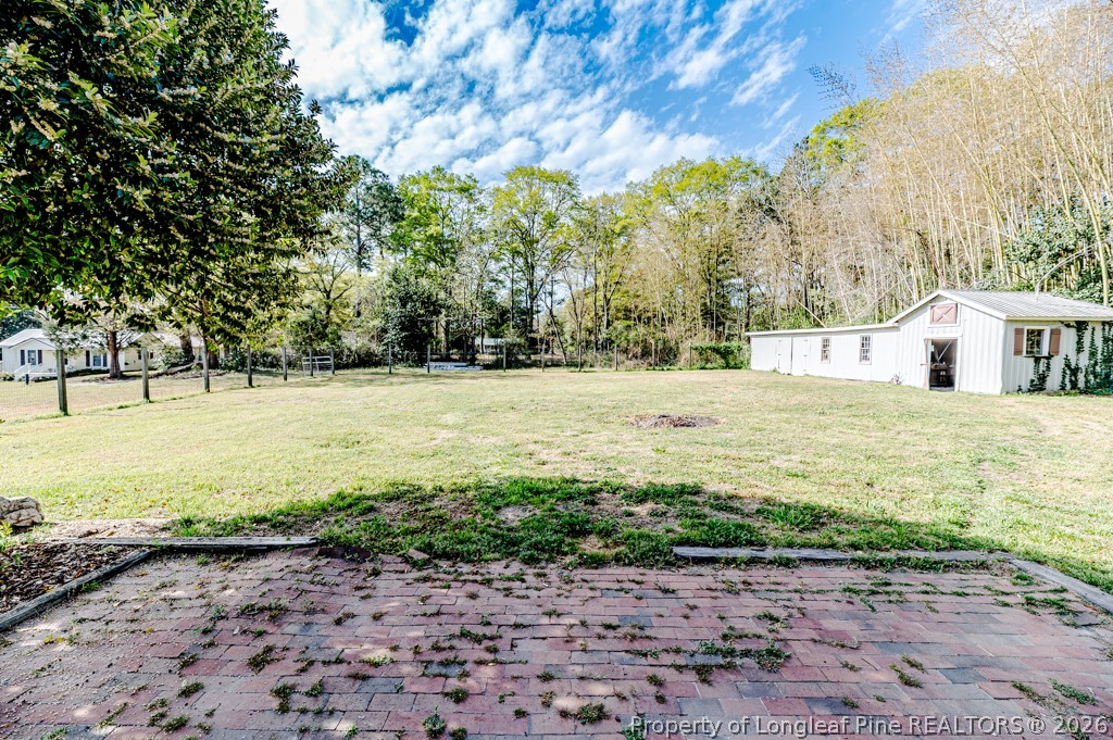 509 Carthage Street Cameron, NC 28326 - Photo 36 of 43 a swimming pool with wooden fence