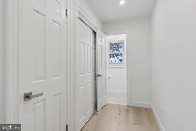 a view of storage and utility room with washer and dryer