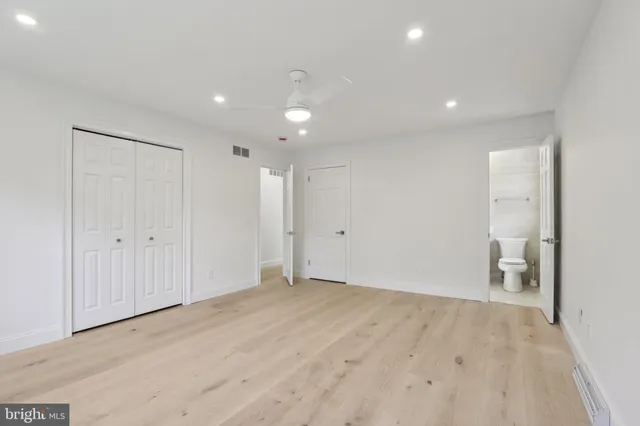 a bathroom with a sink vanity and shower