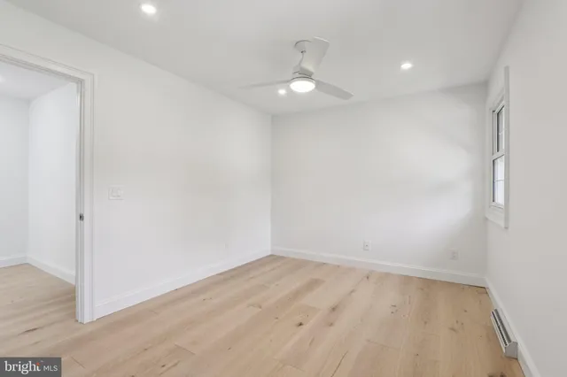 a bathroom with a granite countertop sink a mirror and a vanity