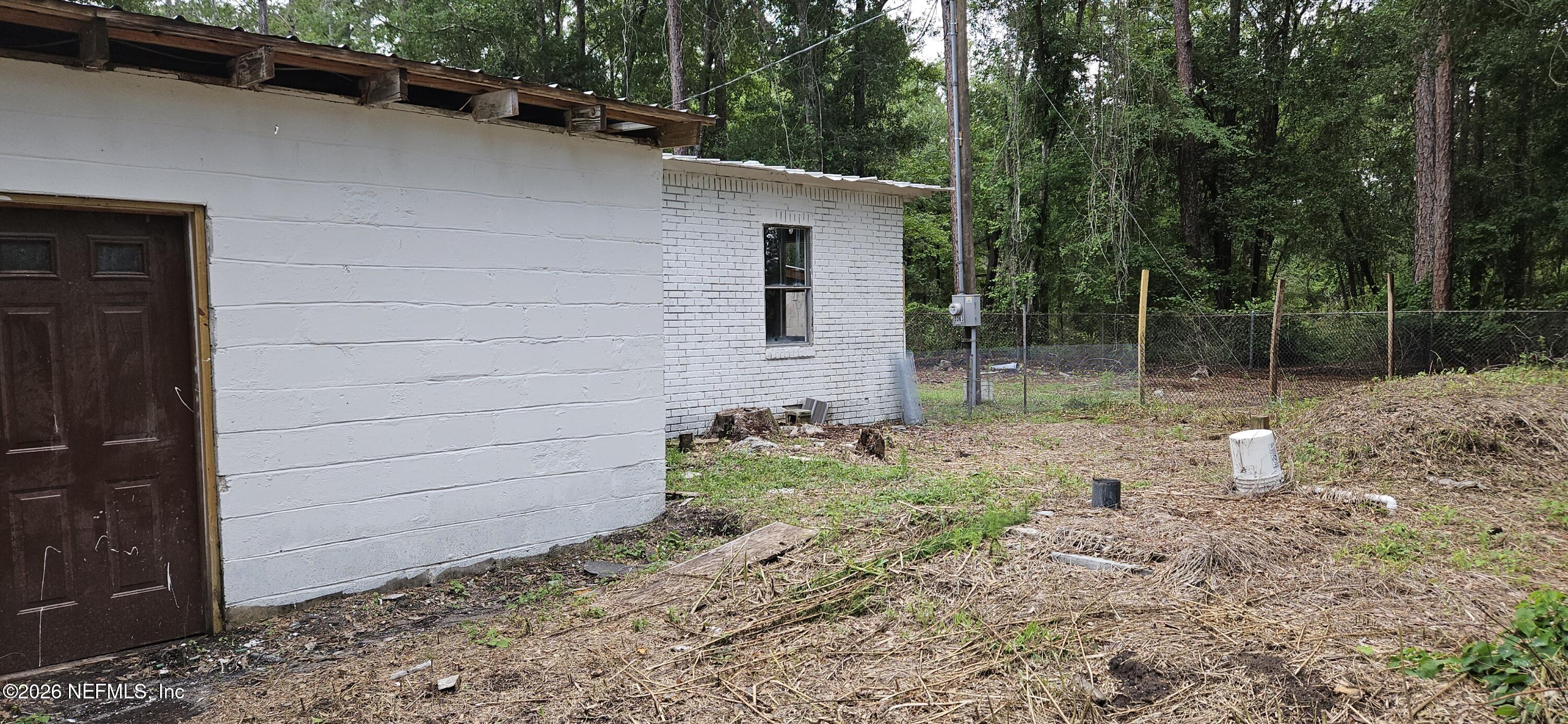 5363 Kilcrease Road Jacksonville, FL 32234 - Photo 23 of 29 a backyard of a house with lots of green space