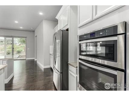 a view of an empty room and wooden floor