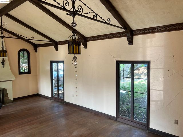 a view of front door and wooden floor