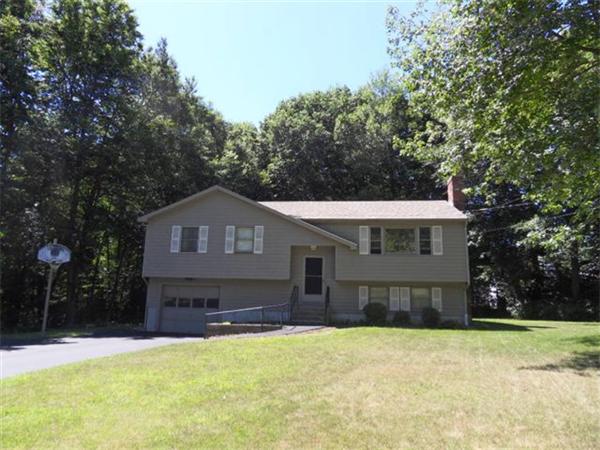 270 Swift Road Northbridge, MA 01588 - Photo 1 of 1 a front view of a house with a yard and garage